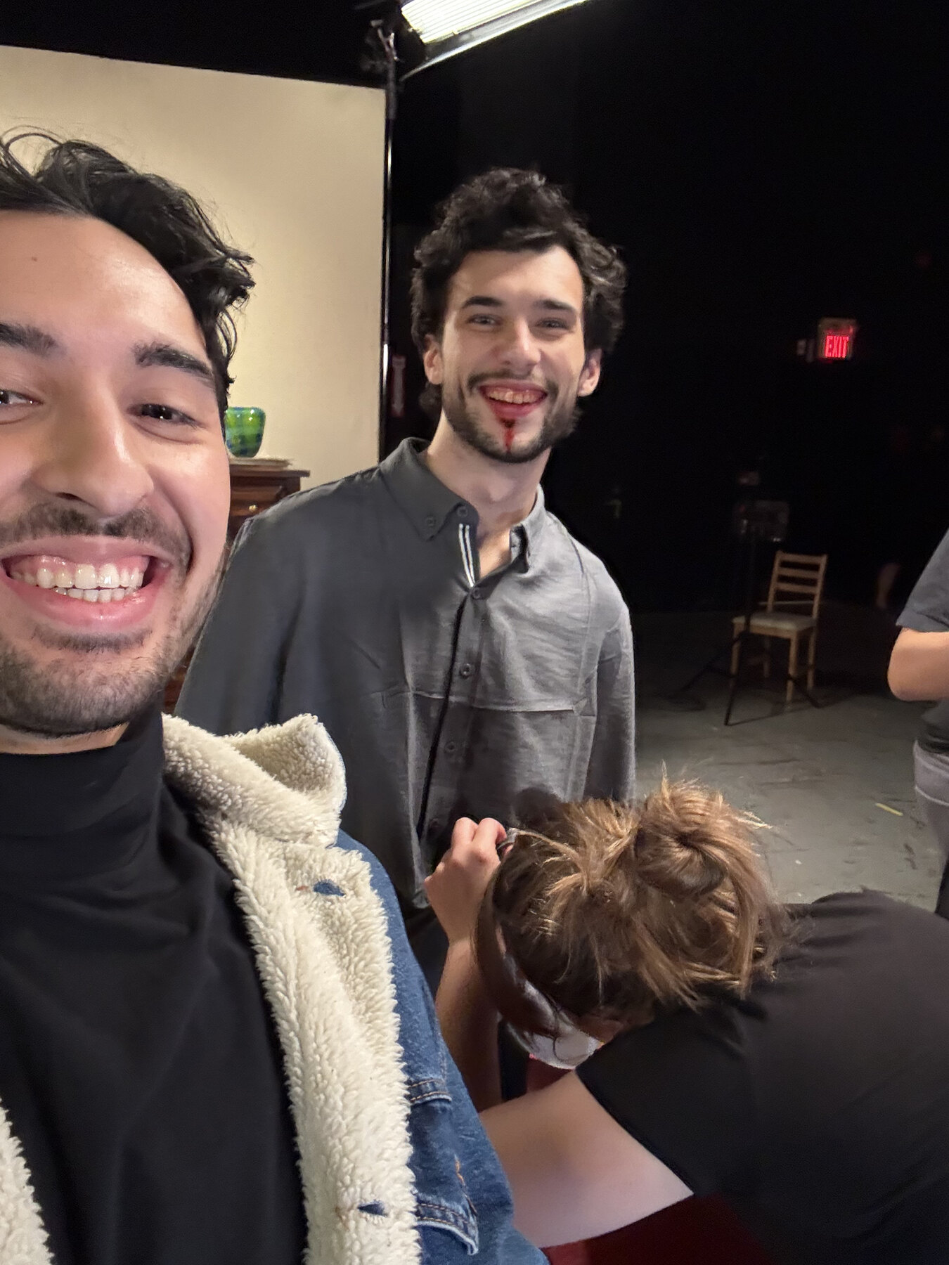 Santiago Henao taking a selfie with a cast member from 2 Birds